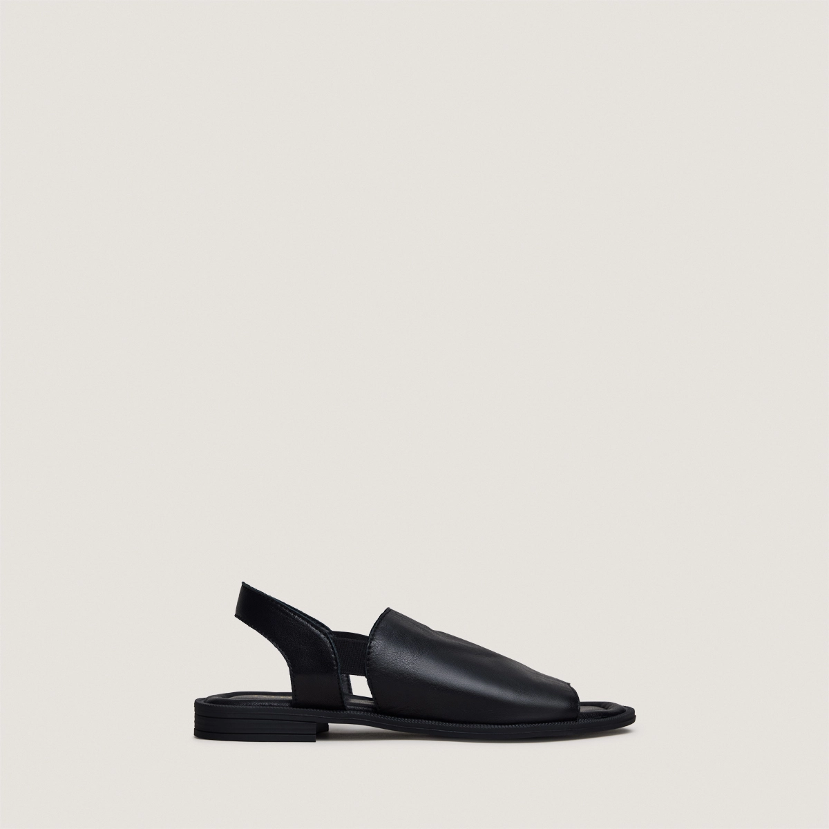 Elastic-strap sandals in black leather | JESS