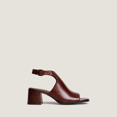 Heeled sandals with an open back in brown patent leather | benita