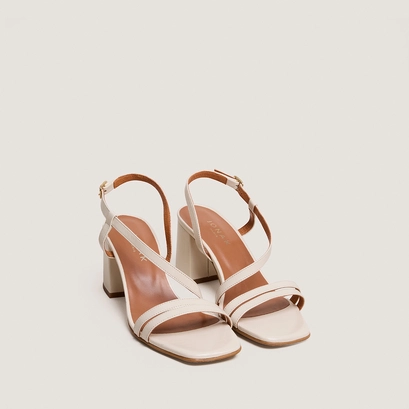 Heeled sandals with straps in ecru aged leather | vimy