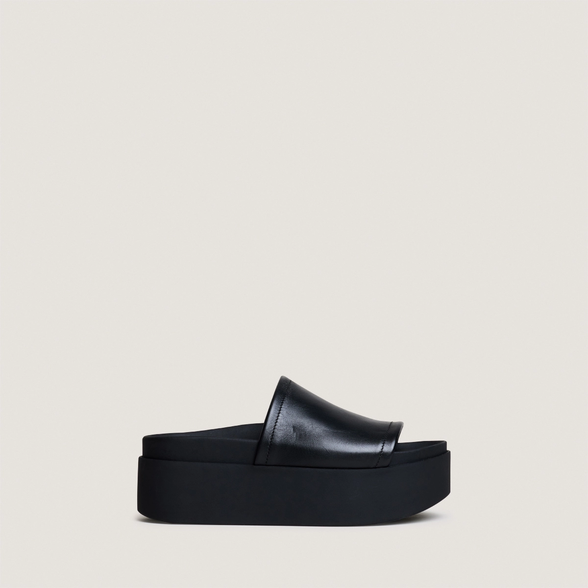 Platform mules in black leather | ETHEL