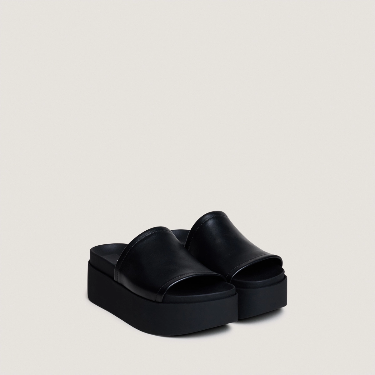 Platform mules in black leather | ETHEL