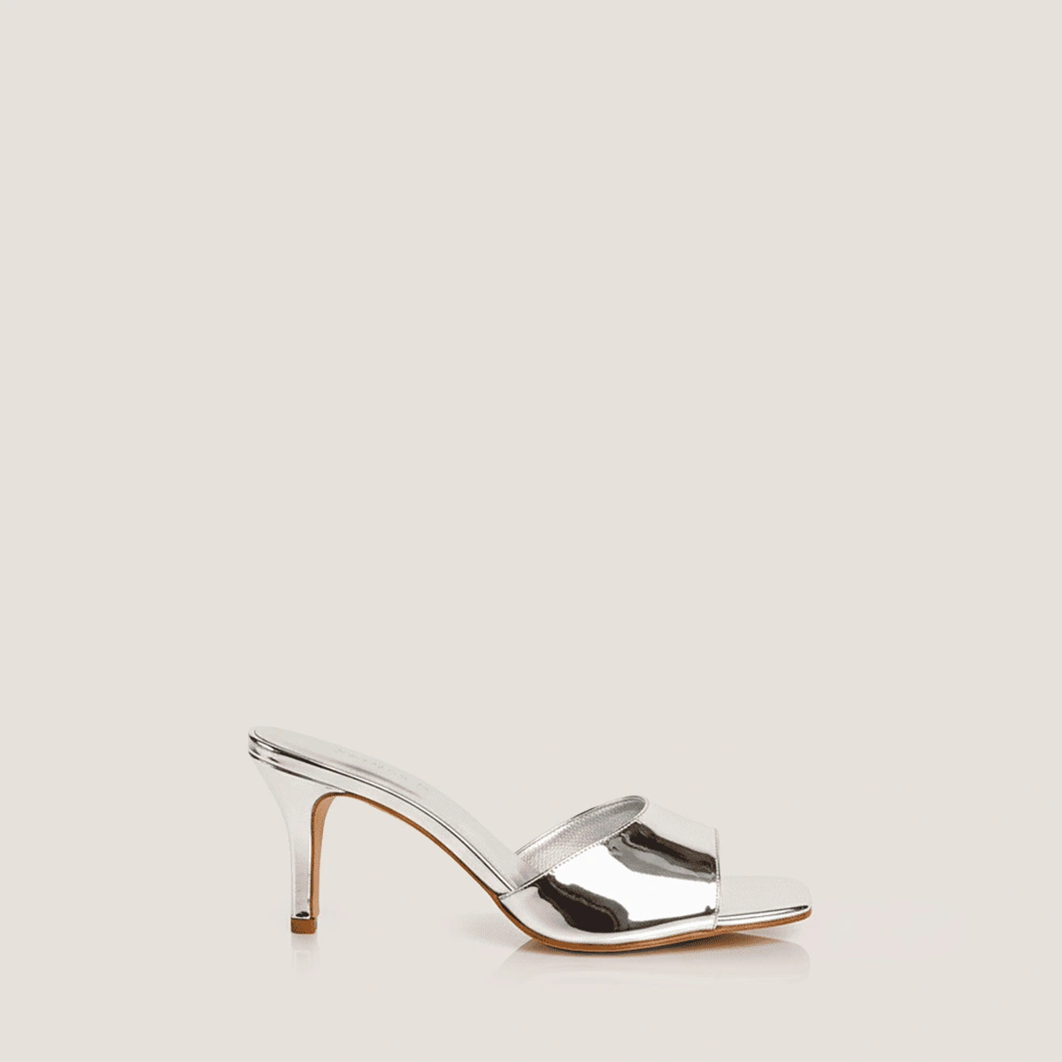Heeled mules in silver mirror leather | VERTIGO