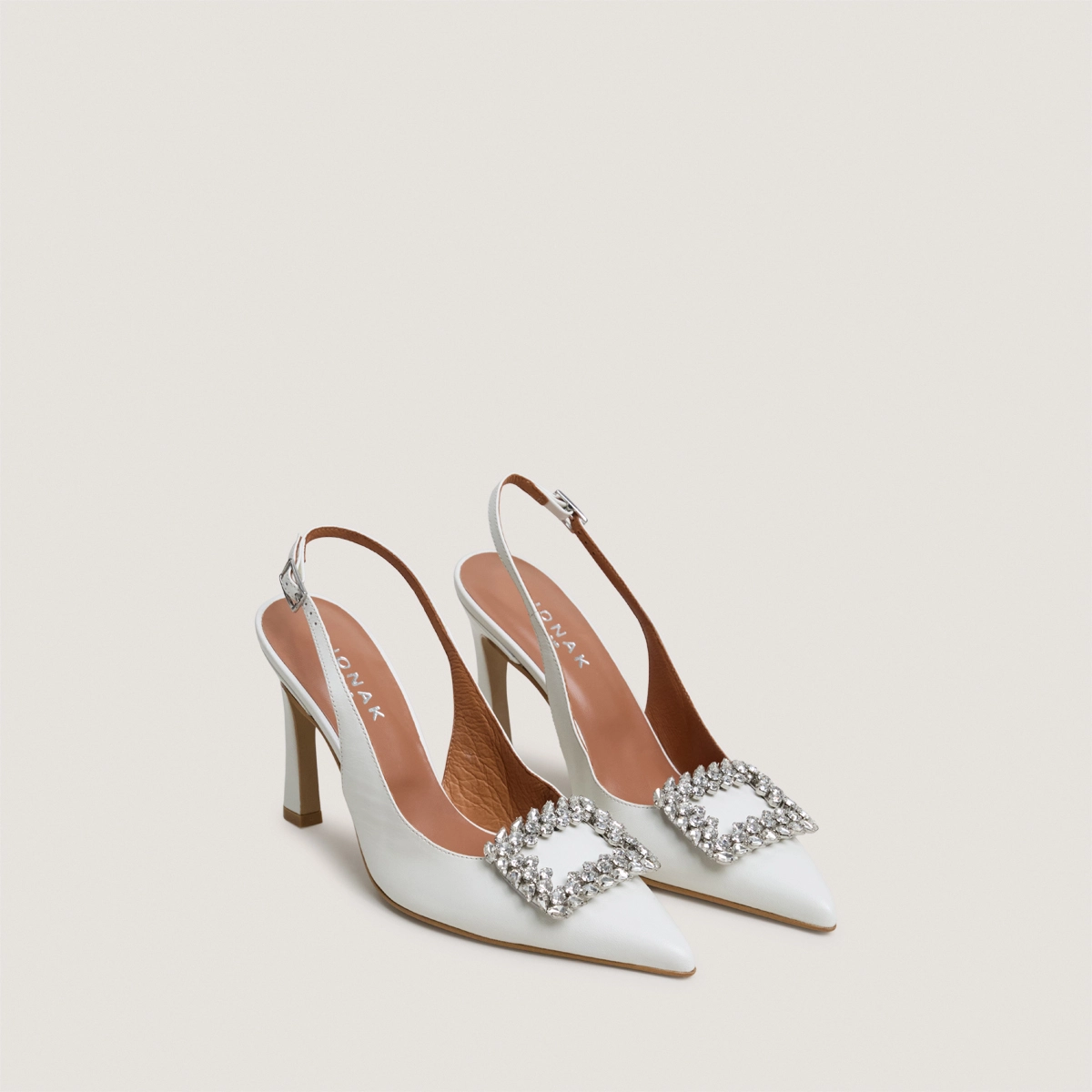 Slingback pumps embellished with rhinestones in ecru leather | DOVELA