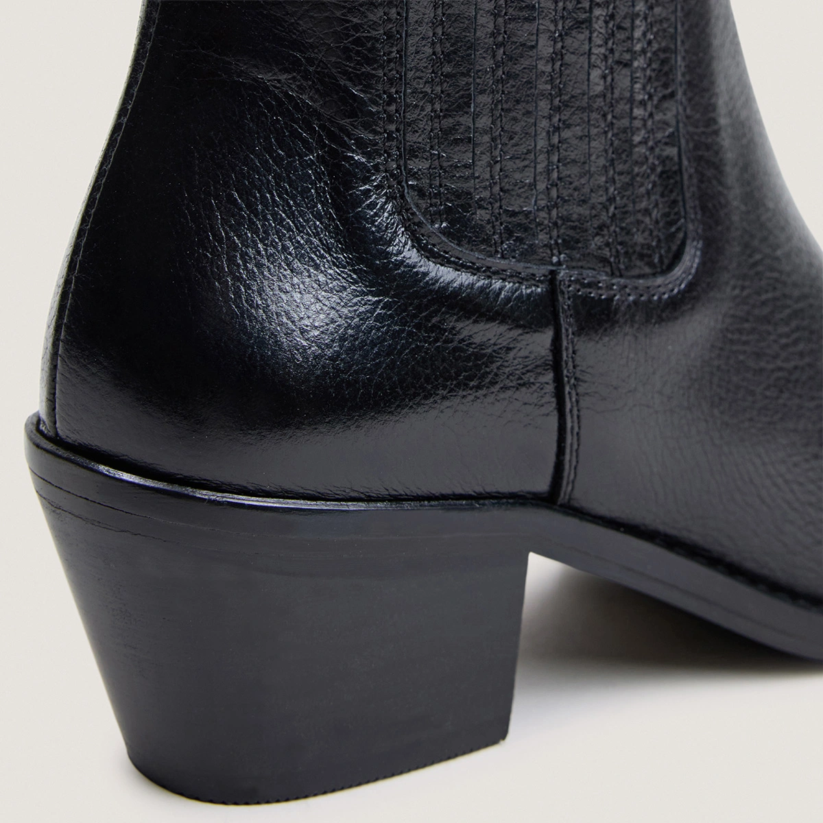 Heeled and gathered ankle boots in black grained leather | BIRMAN