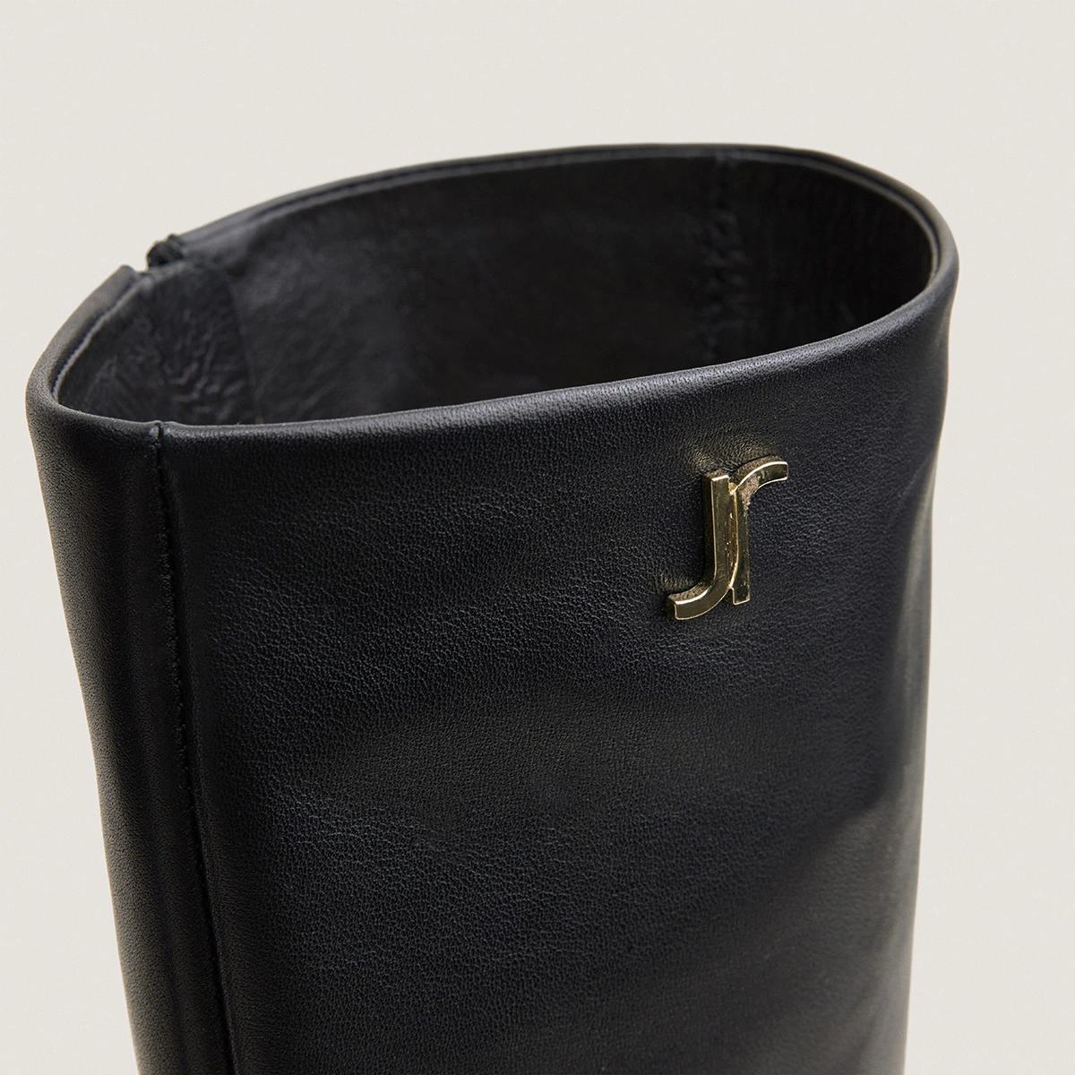 Heeled monogram boots in black leather | VAUBO