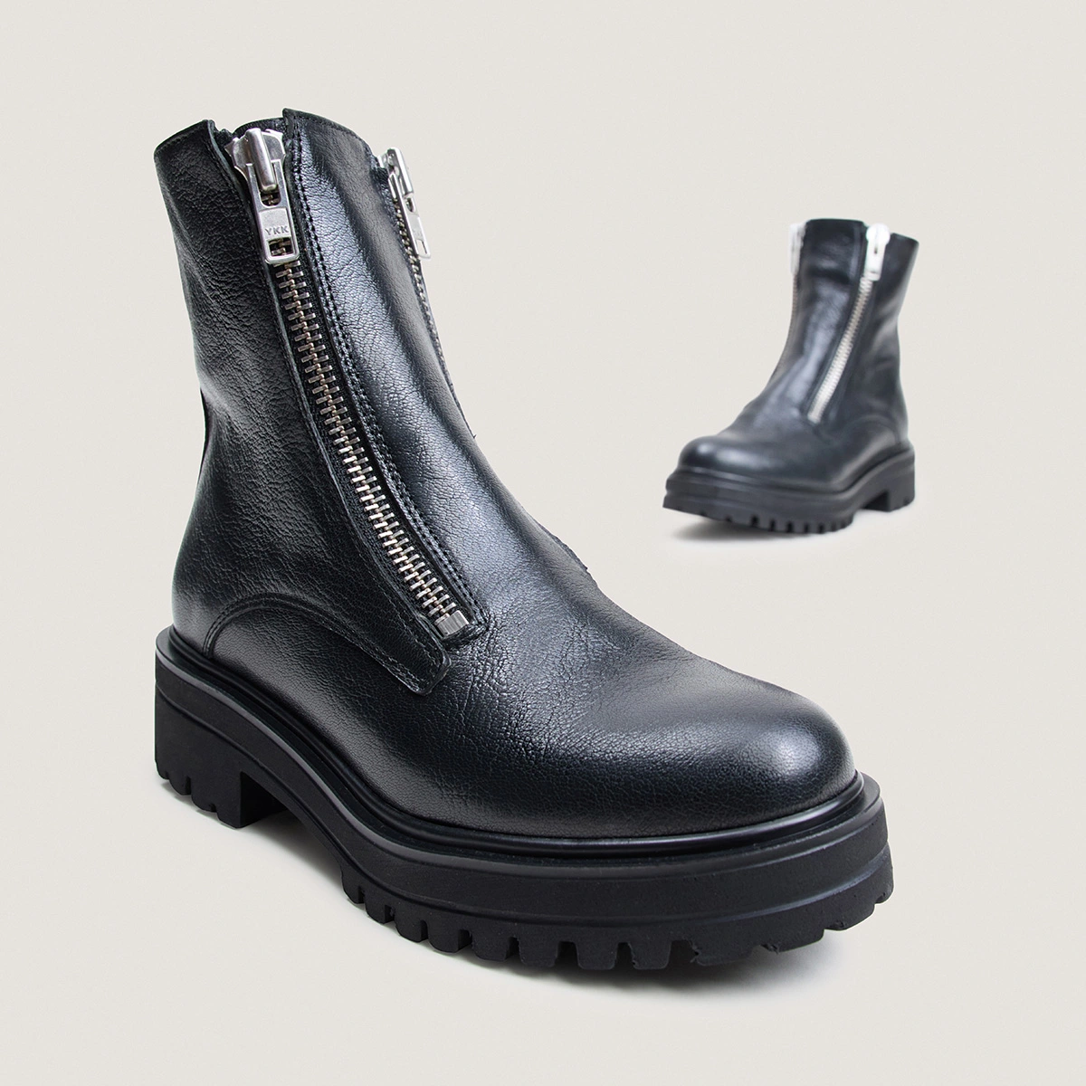 Boots with lug soles and zip in black grained leather | ARZEA