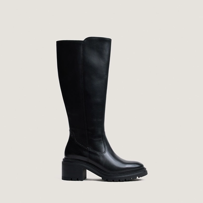 Heeled boots with lug soles in black leather | attitude