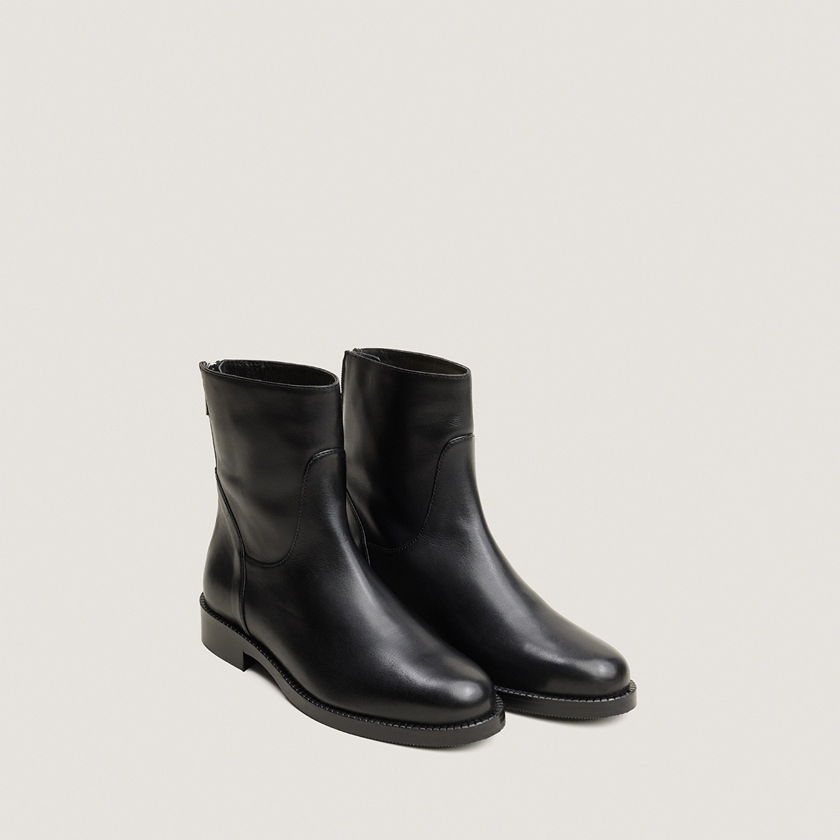 Zip heeled ankle boots in black leather | VELDA