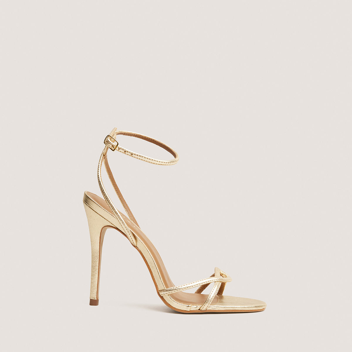 Heeled sandals in gold metallic leather | FABULEUSE