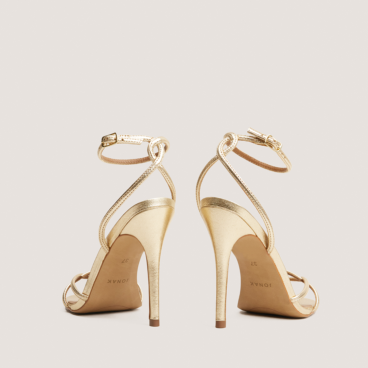 Heeled sandals in gold metallic leather | FABULEUSE