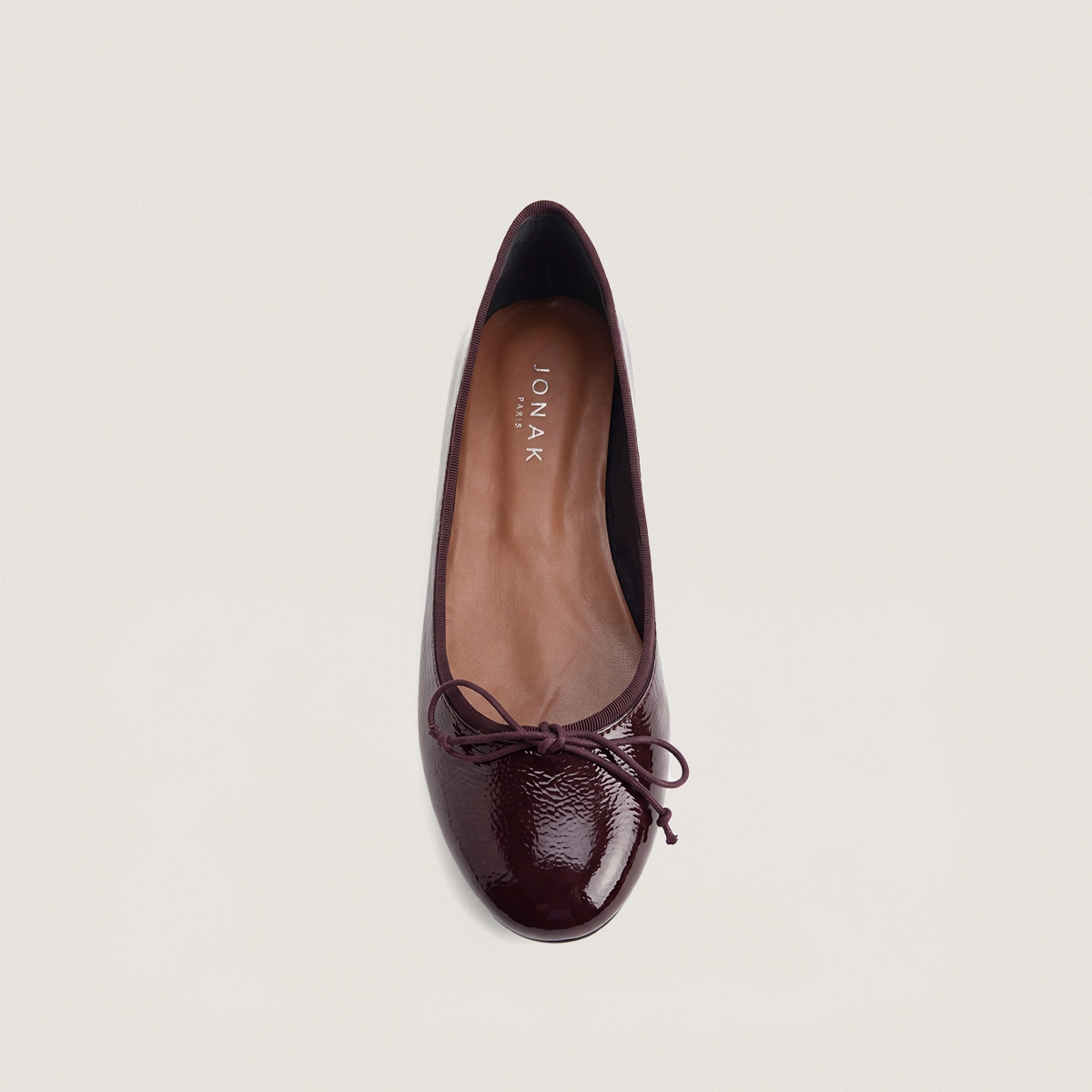 Lace-up ballet flats in burgundy pleated patent leather | DALLERINE