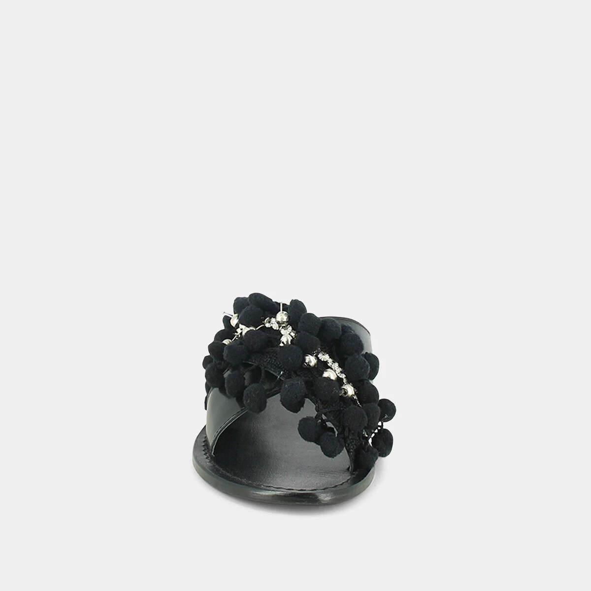 Mules in black leather and textile with pompoms and beads | JACK