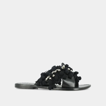 Mules in black leather and textile with pompoms and beads | jack