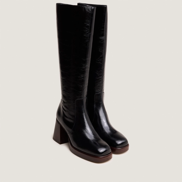 Platform boots in distressed black leather | BETINA