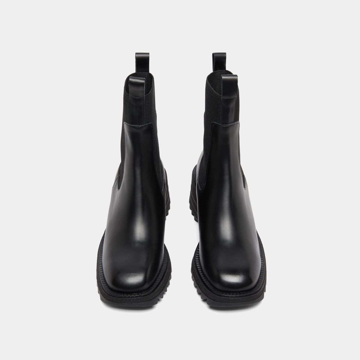 Boots with elastics and notched sole in glazed black leather | DOVE