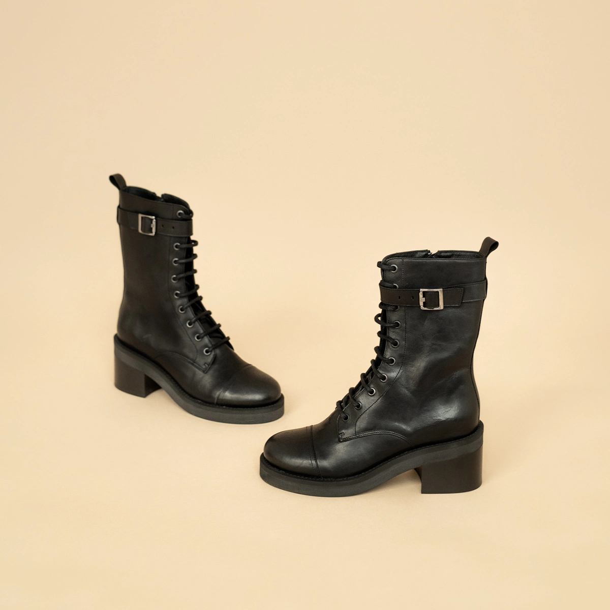 Lace-up ankle boots, heels and silver detail in black greased leather | ACONIT