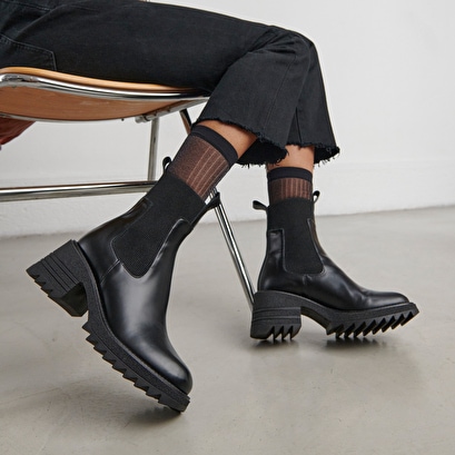 Jonak Women Boots with elastics and notched sole in glazed black leather