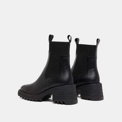 Boots with elastics and notched sole in glazed black leather | dove