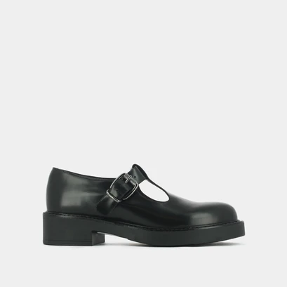 Thick-soled pumps in black shiny leather | didine