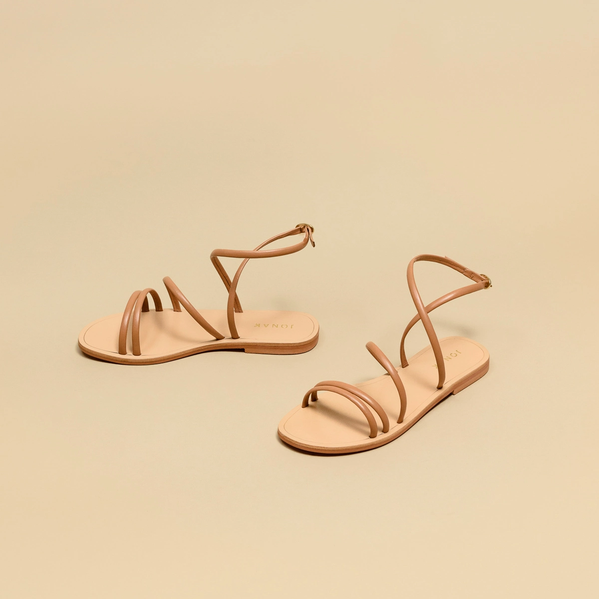 Flat sandals with straps in camel leather | APOLLINE