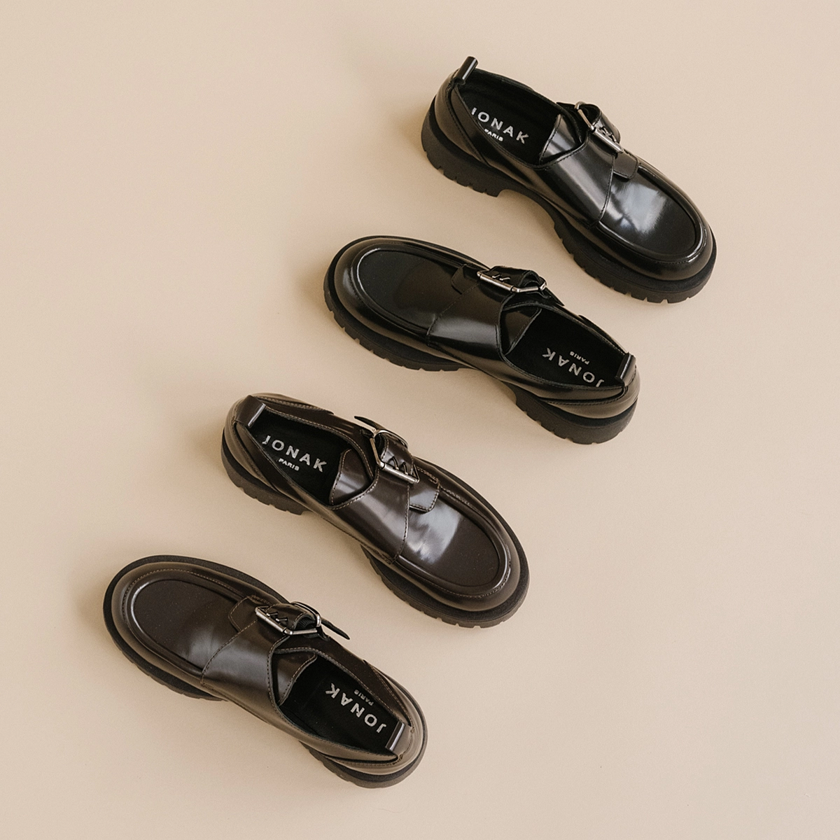 Derbies with flat heels, buckles and visible seams in black shiny leather | RAID