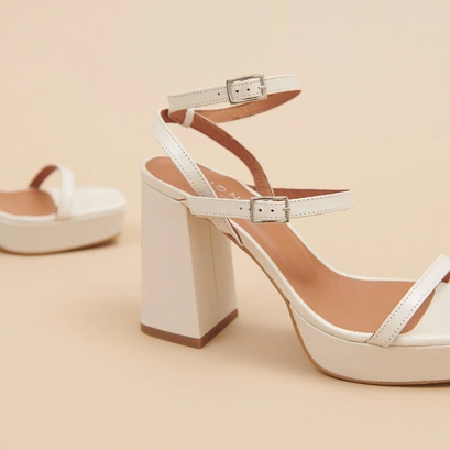 Strap and platform sandals in unbleached distressed leather | vlado