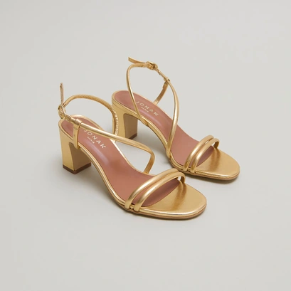 Sandals with heels and straps in gold metallic leather | vicente
