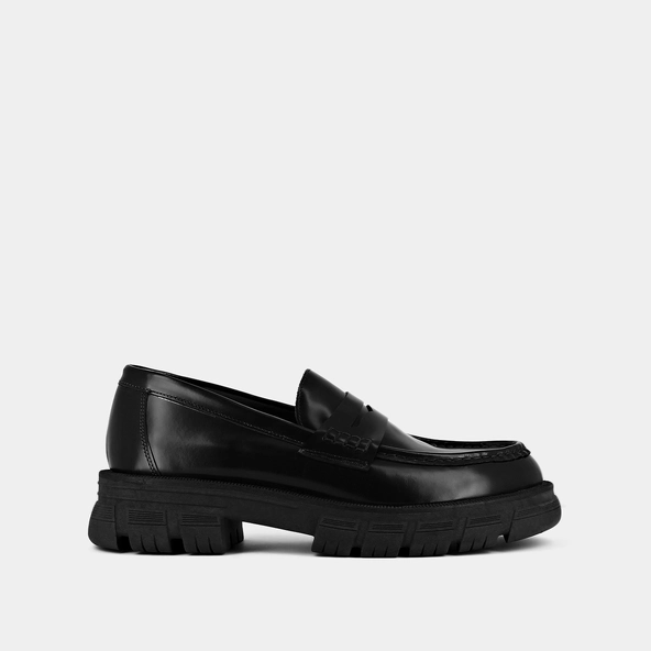 Moccasins with notched soles in glazed black leather | DIAQUO