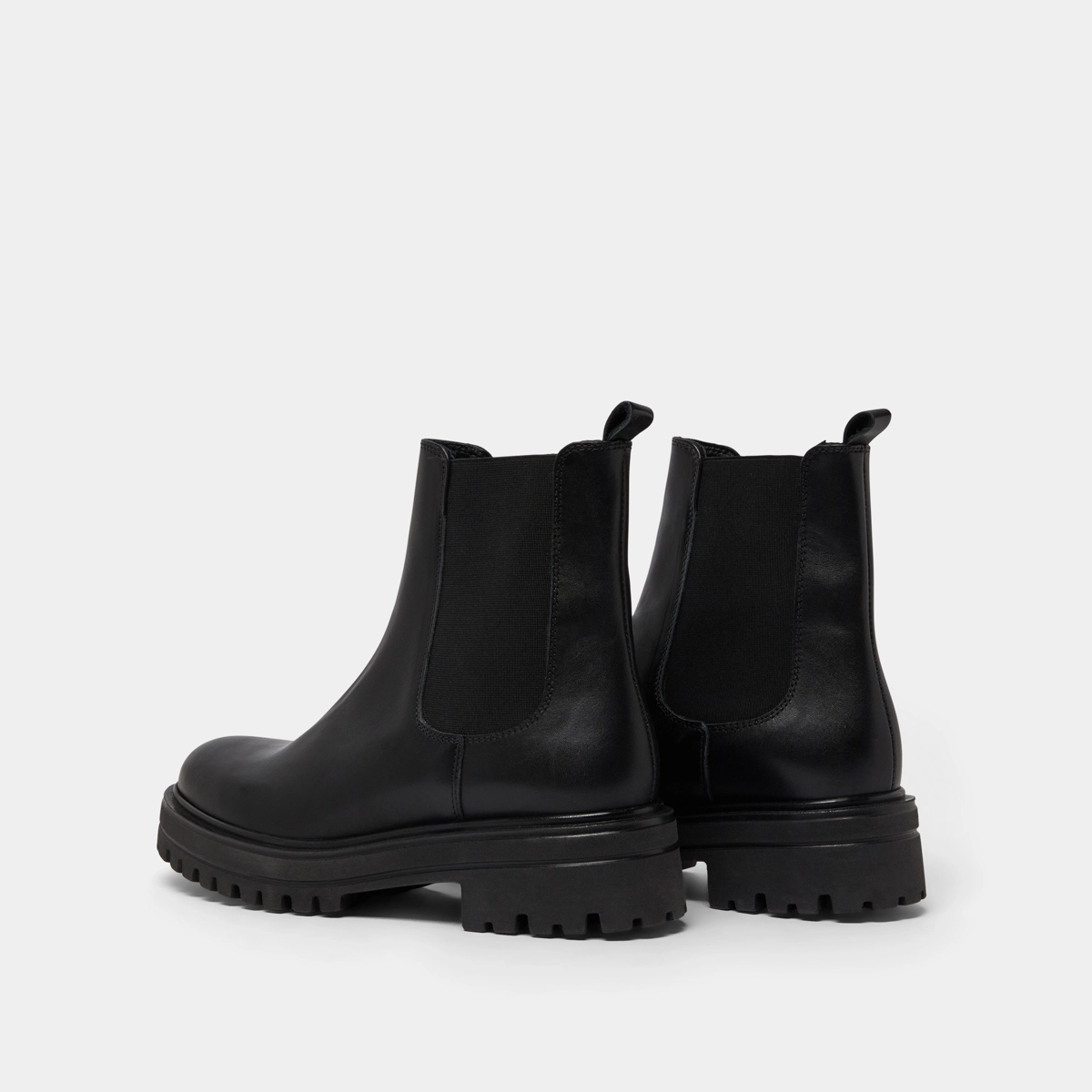 Boots with notched and elastic soles in black leather | AMANDINE