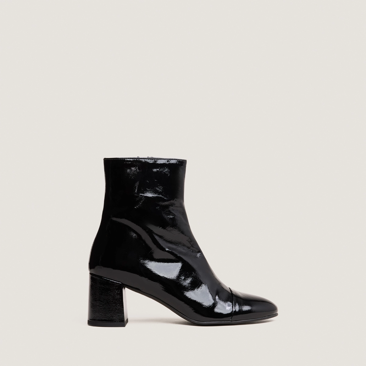 Heeled boots in black pleated patent | DONIAMA