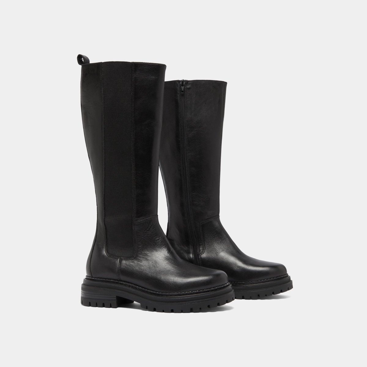Boots with round toes and notched soles in black leather | ADAL