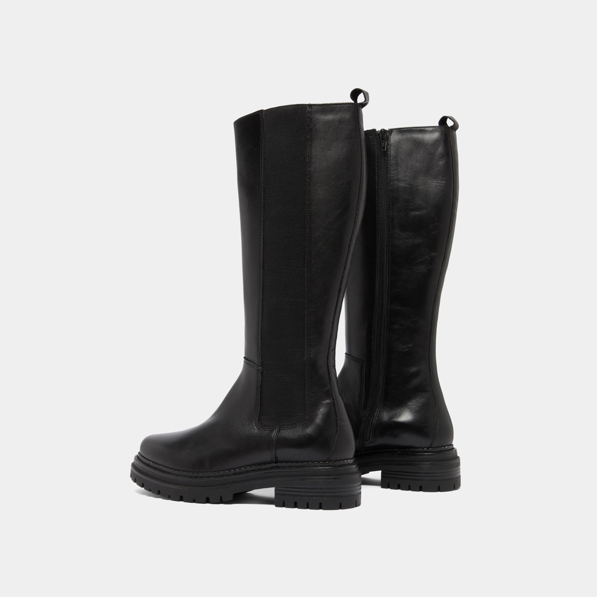 Boots with round toes and notched soles in black leather | ADAL
