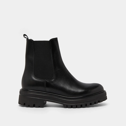 Boots with notched and elastic soles in black leather | amandine