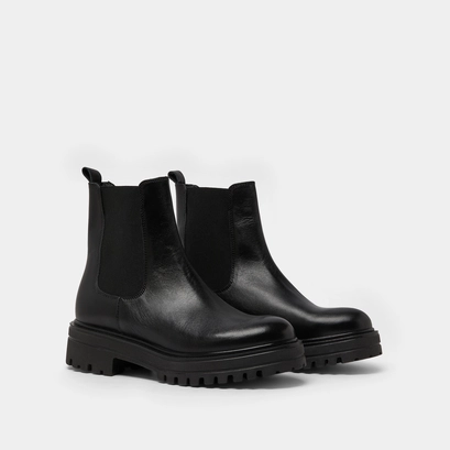 Boots with notched and elastic soles in black leather | amandine