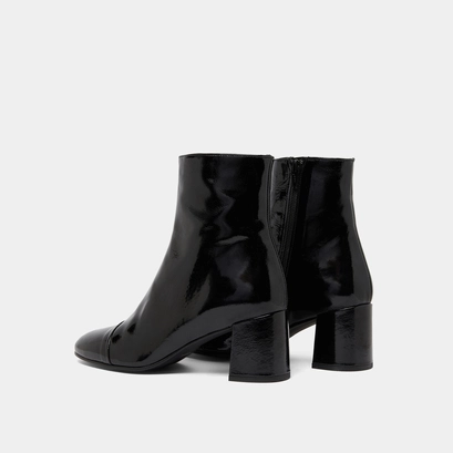 Heeled boots in black pleated patent | doniama