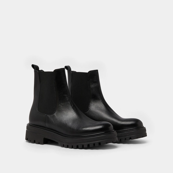 Boots with notched and elastic soles in black leather | AMANDINE