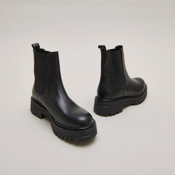 Boots with notched and elastic soles in black leather | AMANDINE
