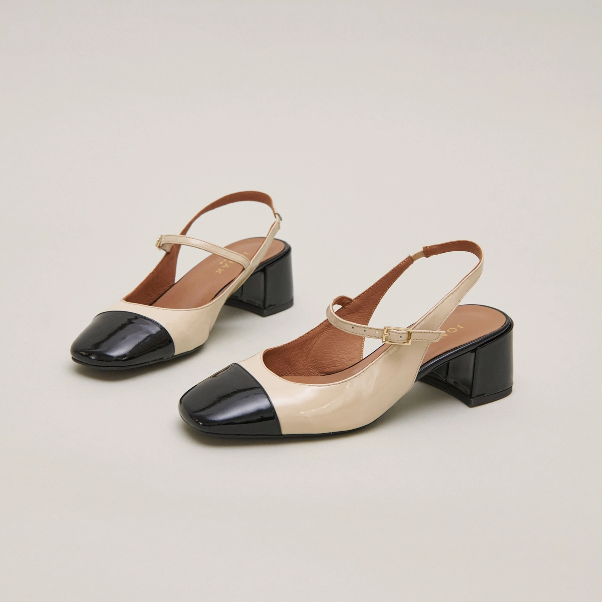 Heeled Mary Janes in black and ecru patent | DOUMY