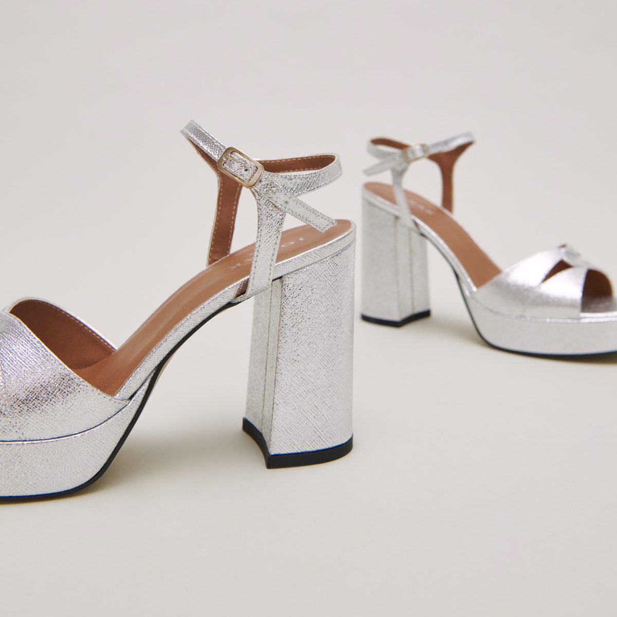 Platform sandals and high heels in silver metallic textile | JUSTINE