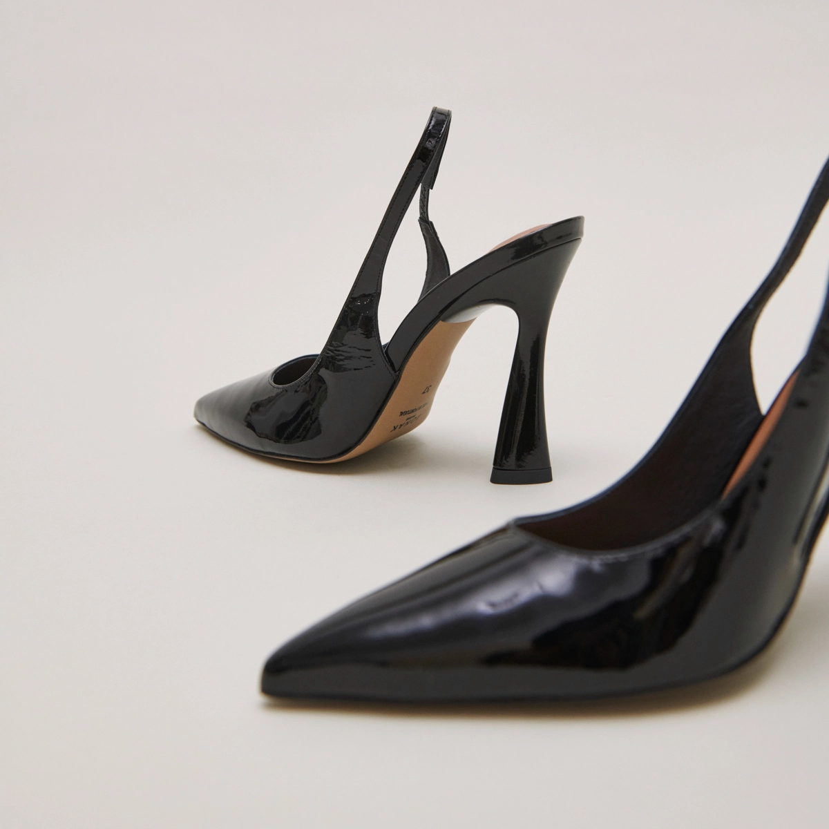 Pointed toe slingback pumps in black patent | DRESSY