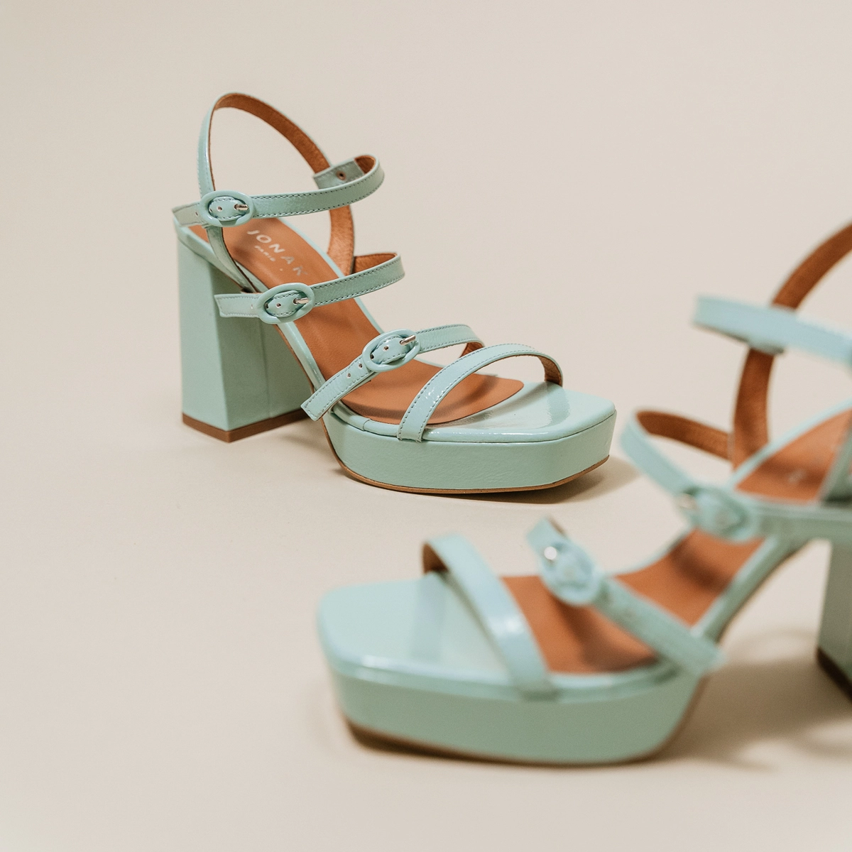 Sandals with straps and square toes in turquoise pleated leather | VALENS