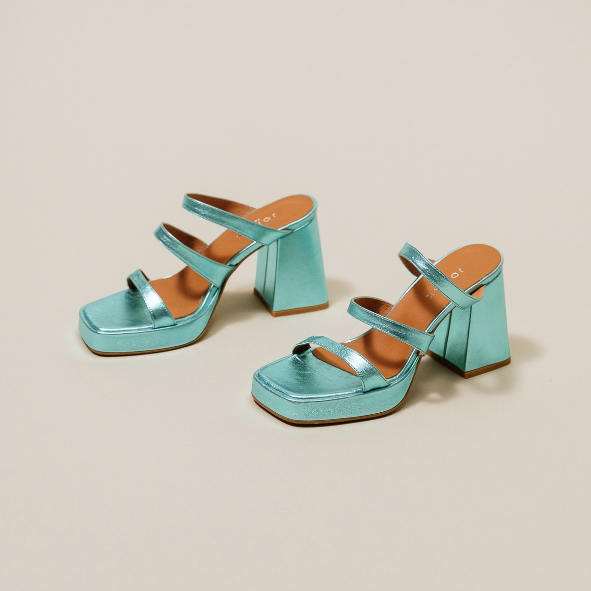 Mules with straps and square toes in turquoise metallic leather | DONZELLE