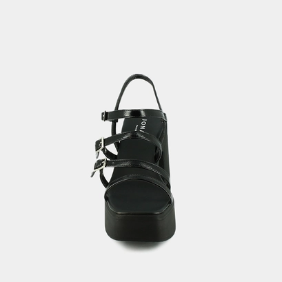 Sandals with straps and platforms in black pleated patent | puzzle