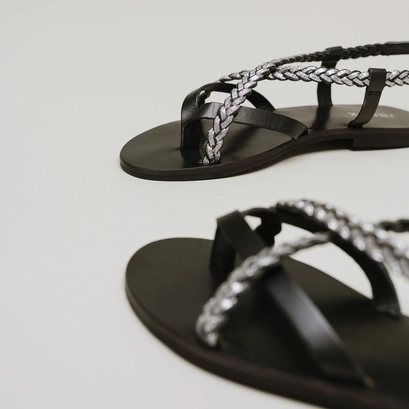 Sandals with braided straps in black and silver leather | warren