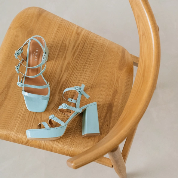 Sandals with straps and square toes in turquoise pleated leather | VALENS