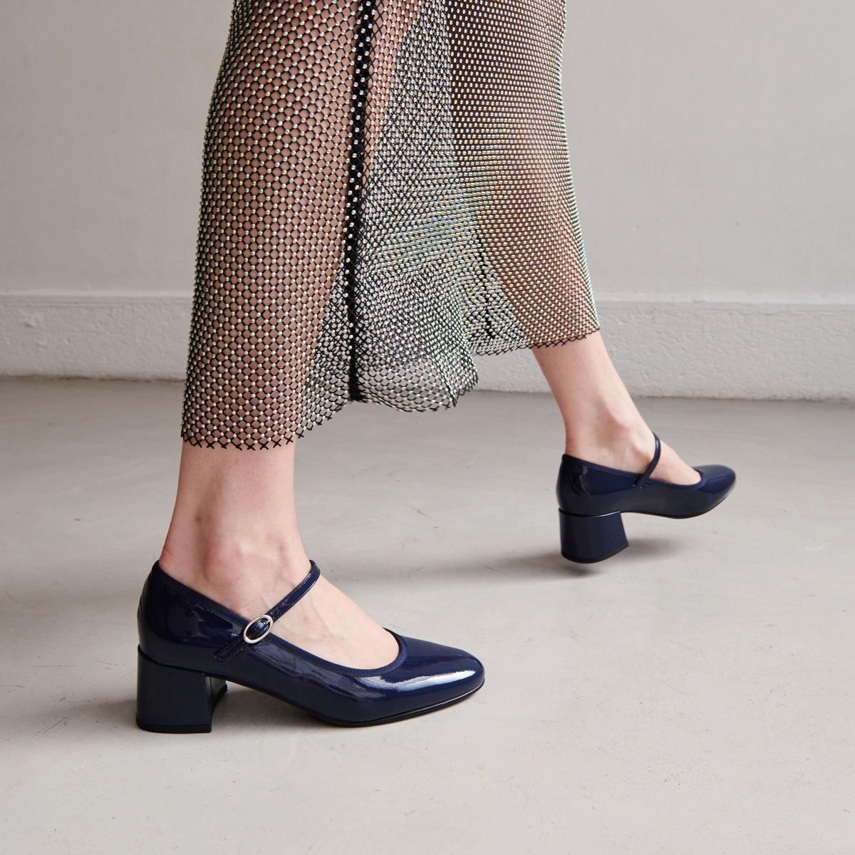 Heeled slippers in blue patent leather | DALMATIE