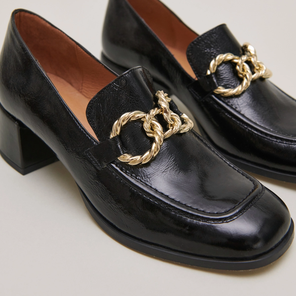 Round-toed loafers with gold buckles in black glazed leather | VINCENNES