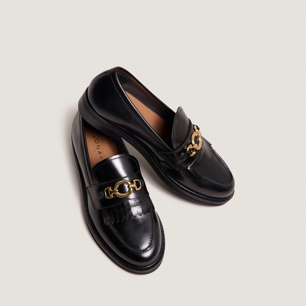 Loafers with gold buckles in black leather | DELPHES