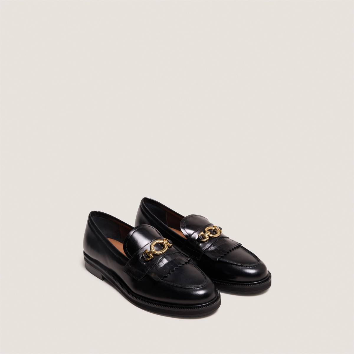 Loafers with gold buckles in black leather | DELPHES