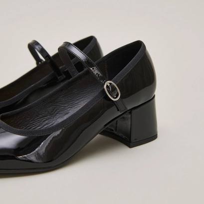 Heeled slippers in black patent leather | dalmatie